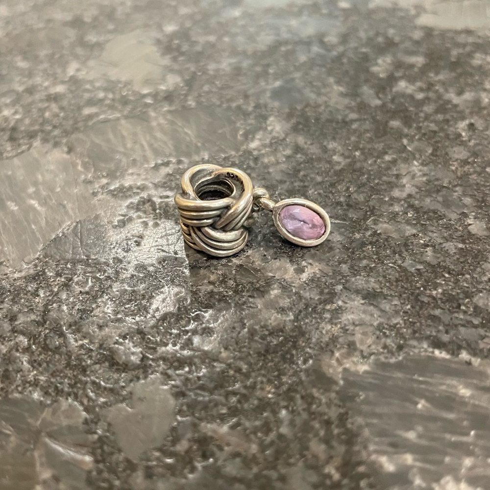 Authentic Pandora retired tied together charm with pink amethyst